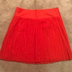 Orange pleated work skirt